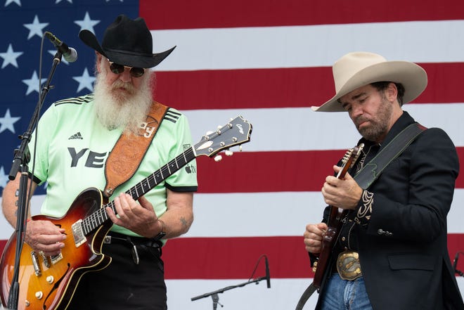 Ray Benson (R) of Asleep at the Wheel performs in concert during Willie Nelson's 4th of July Picnic at Q2 Stadium on July 04, 2023 in Austin, Texas.