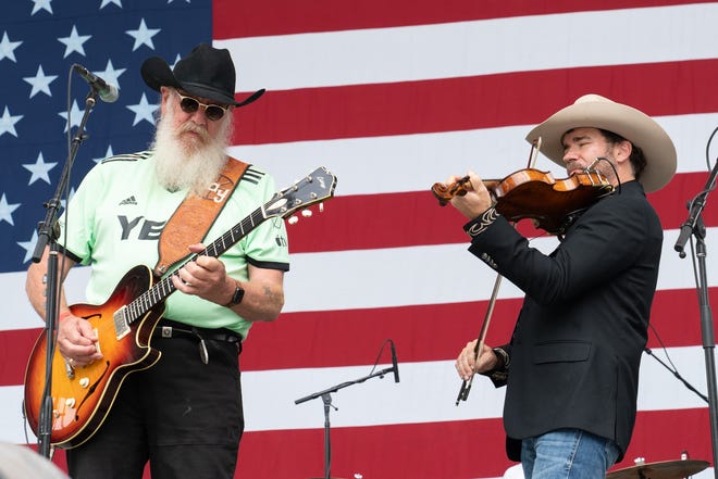 Ray Benson (L) of Asleep at the Wheel performs in concert during Willie Nelson's 4th of July Picnic at Q2 Stadium on July 04, 2023 in Austin, Texas.